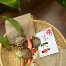 Thenga Eco-Friendly Coconut Shell Rakhis for Brothers  - polished  (Includes 3 Rakhis, Jute Potli & Raksha Bandhan Card) - Set of 3