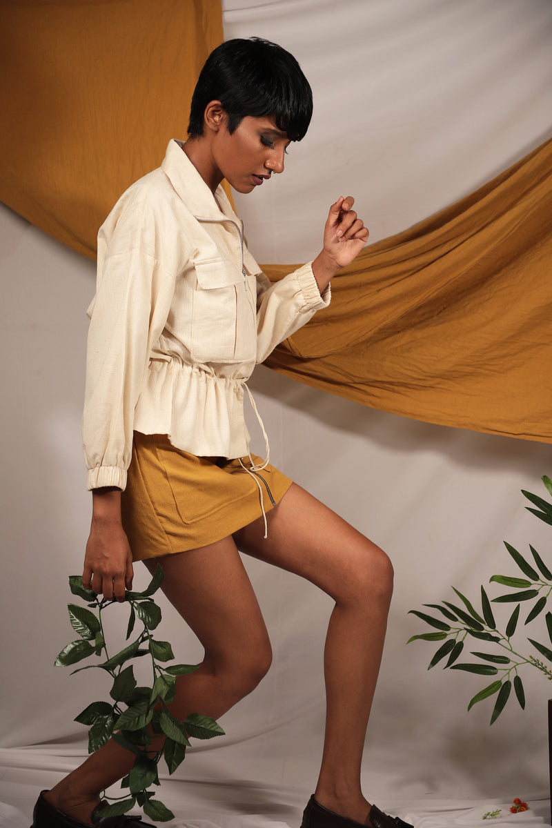 Ethically made Ivory linen Bomber jacket with tie up details to cinch your waist and chest pockets